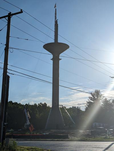 Construction of a water tower, up to the holding area at the top. 